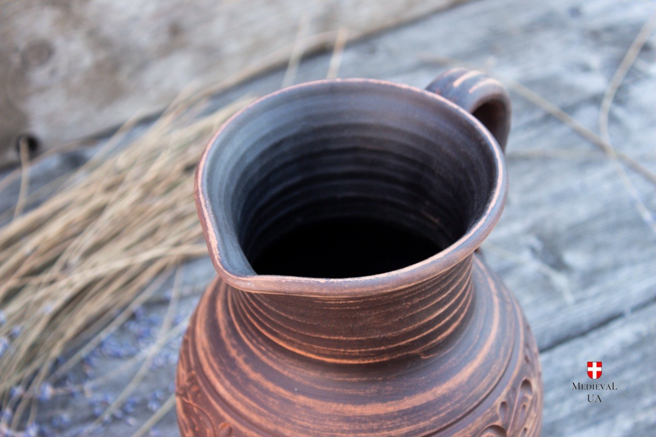 Interior and pouring spout of large handmade clay jug