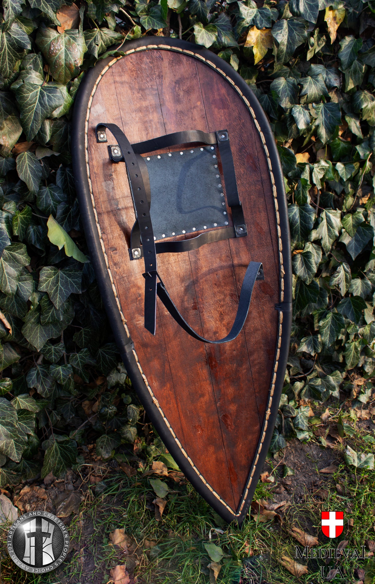 Big dark blue kite medieval shield with a dark red Dragon pattern