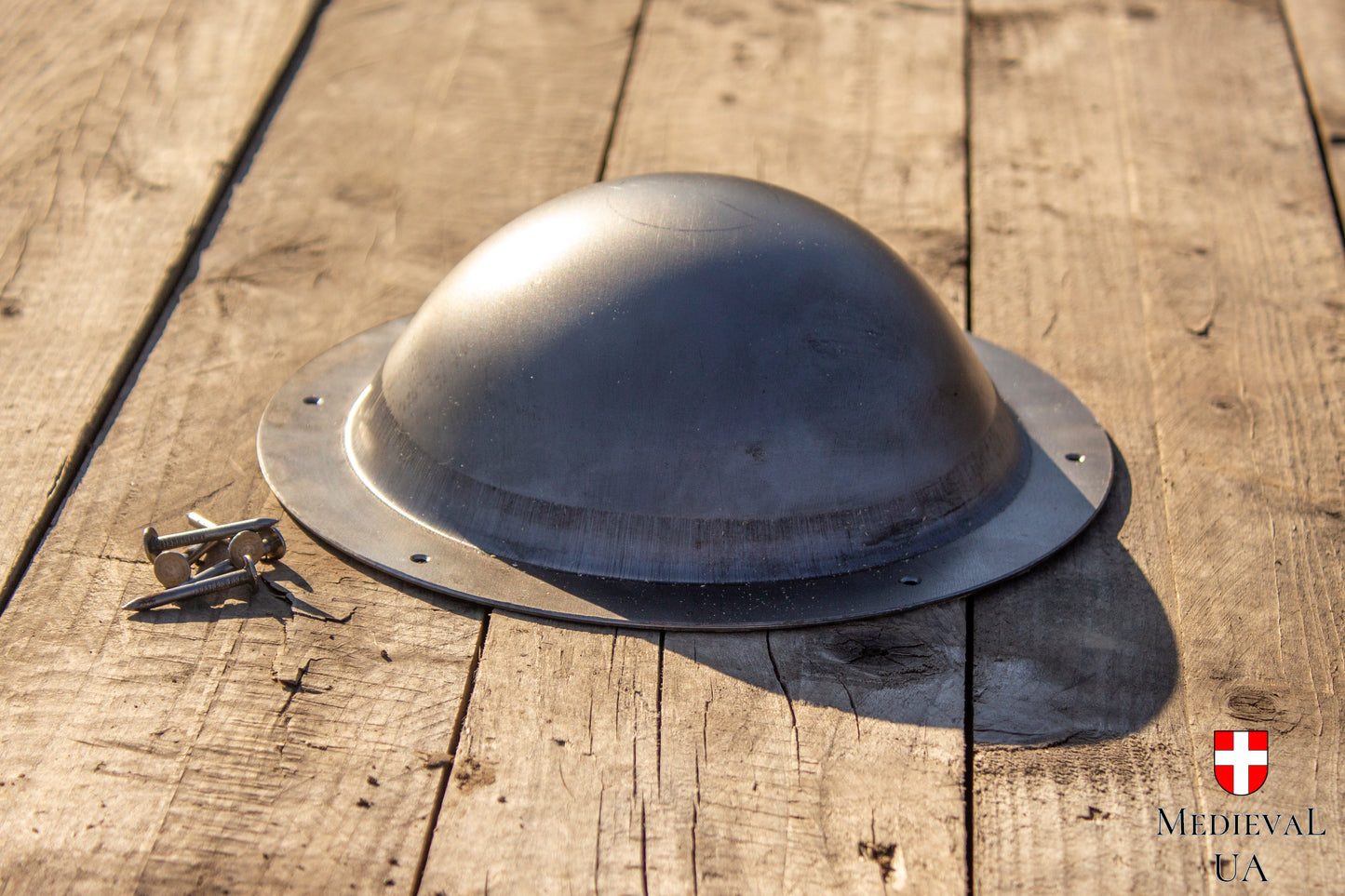 Steel shield boss