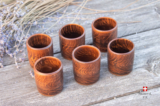 Set of six handmade ceramic shot glasses in unglazed red clay