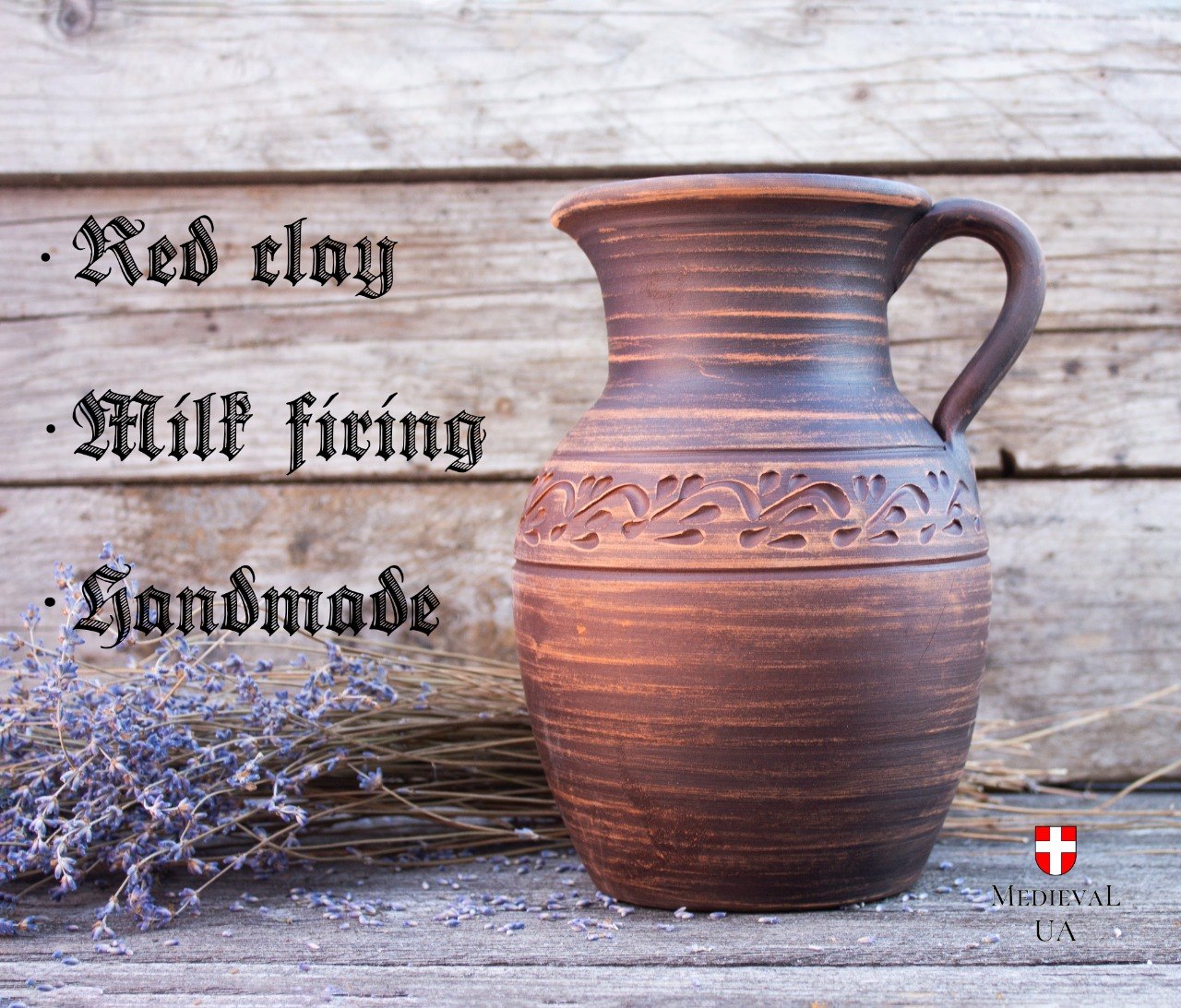 Handmade red clay medieval pitcher, milk-fired, front view
