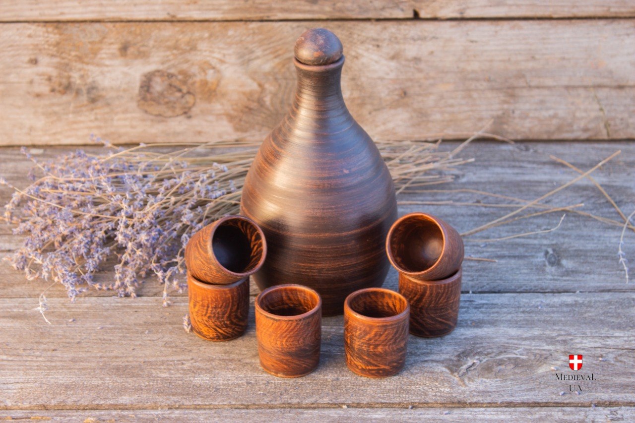 Complete mead set: plain clay bottle and six red clay cups