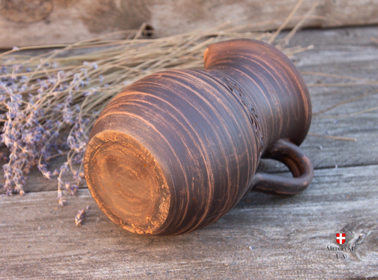 Bottom view of handmade medieval clay pitcher base