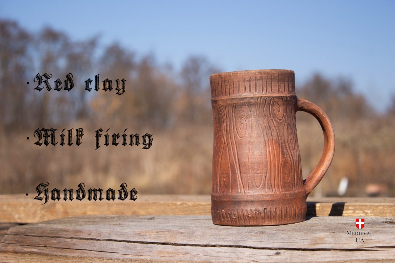 Red clay Viking tankard on weathered wood with a feature list: red clay, milk firing, handmade