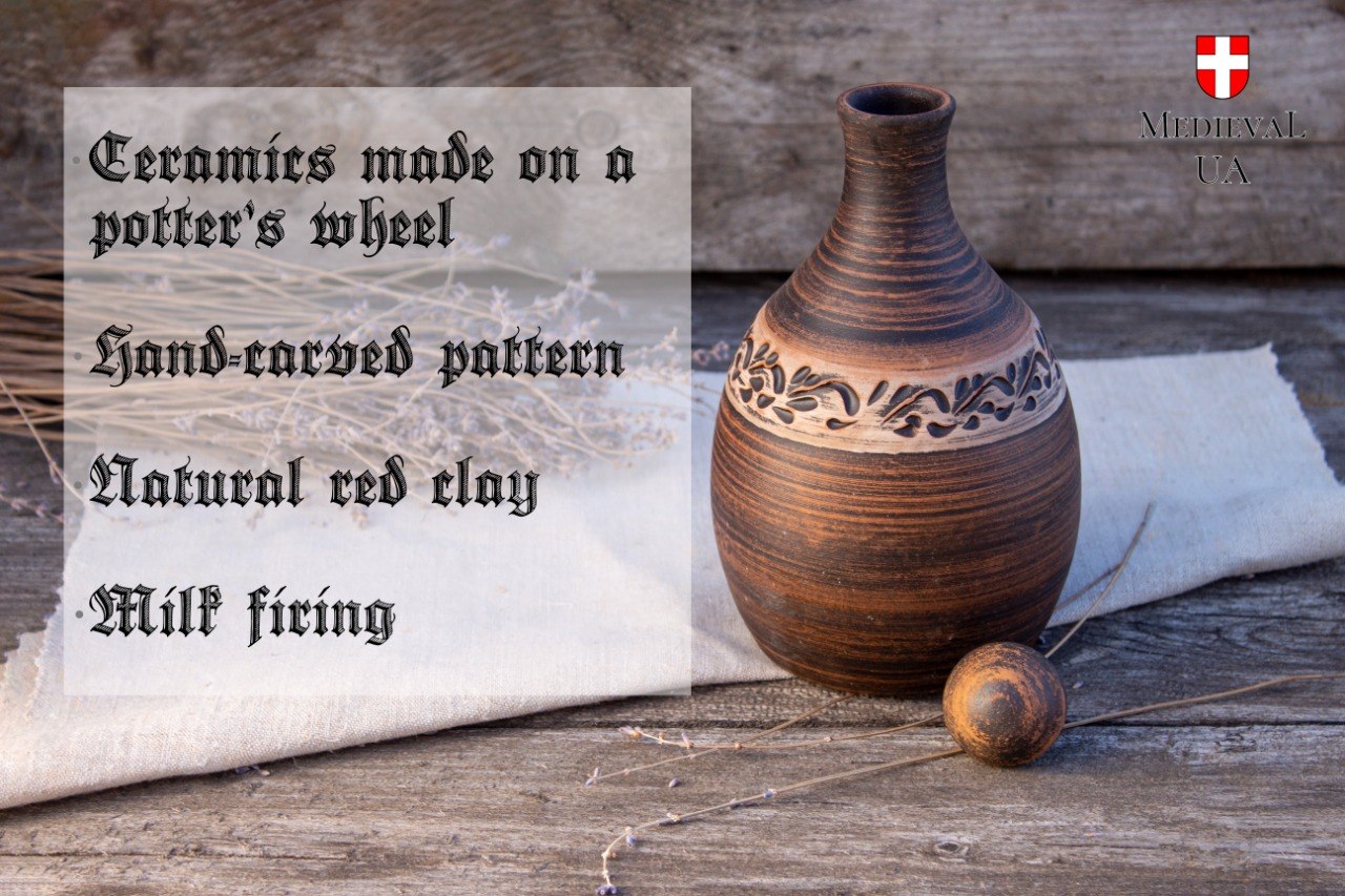 Wheel-thrown milk-fired clay mead bottle with hand-carved pattern