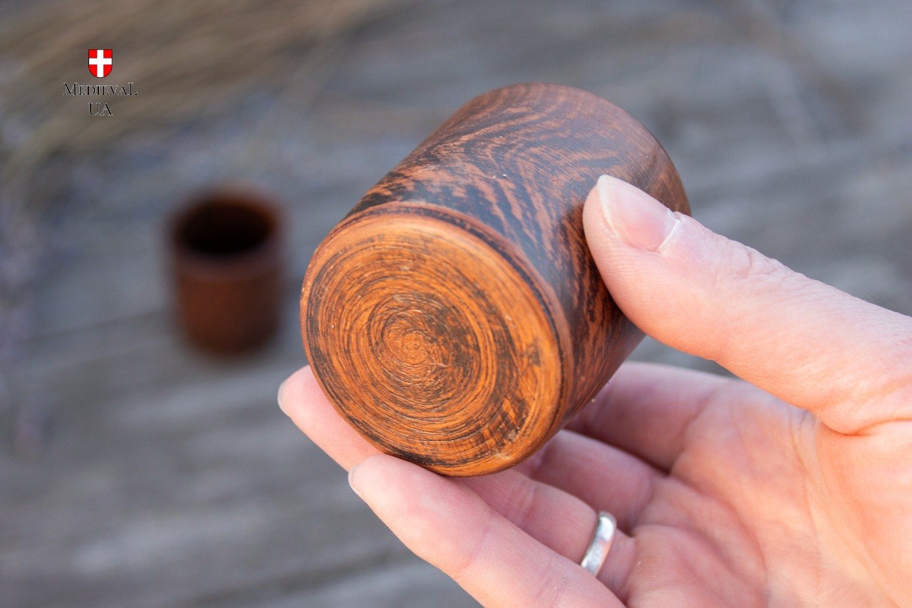 Trimmed foot of a wheel thrown pottery shot cup with spiral tool marks
